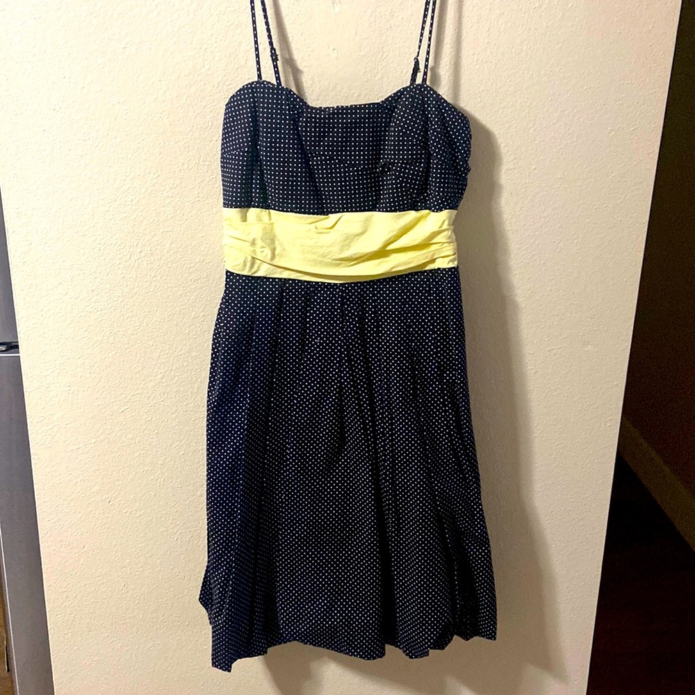 Medium Maurices black and white polkadot with a yellow bow dress